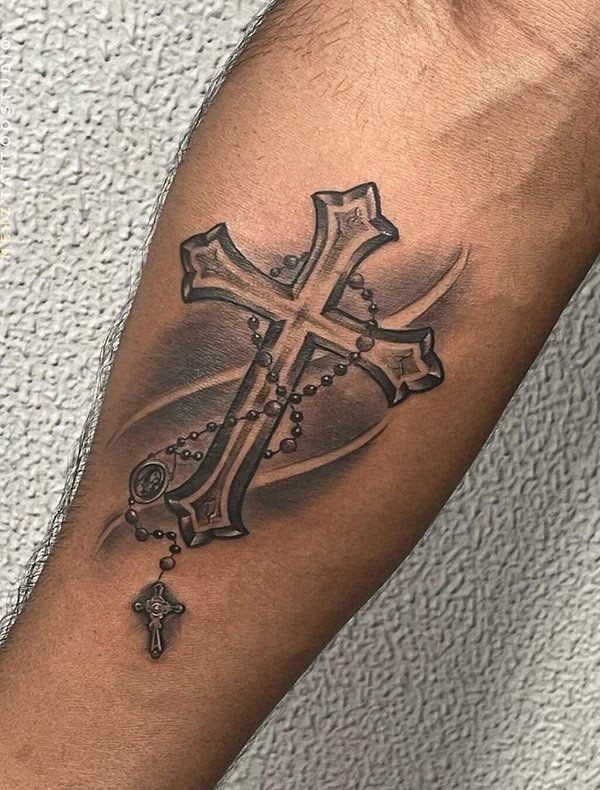 Black and grey cross and rosary tattoo, forearm